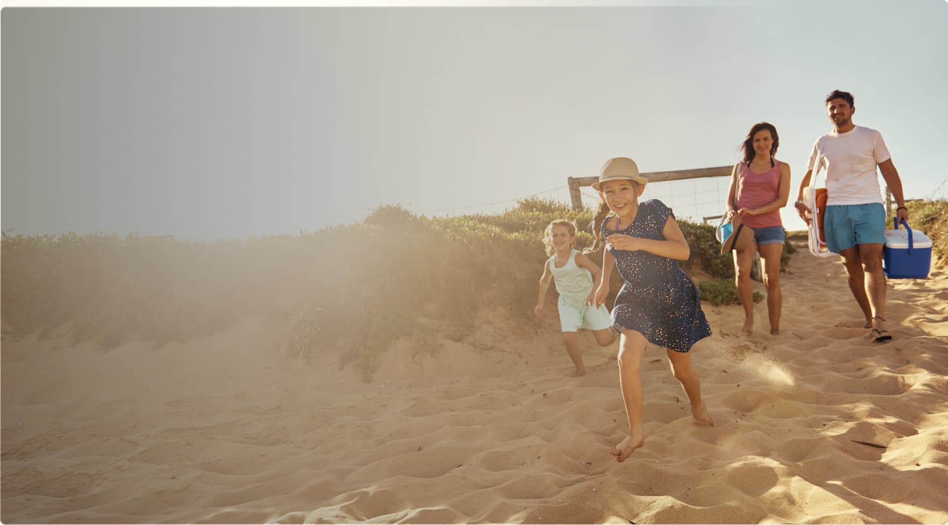 A family arriving at the beach