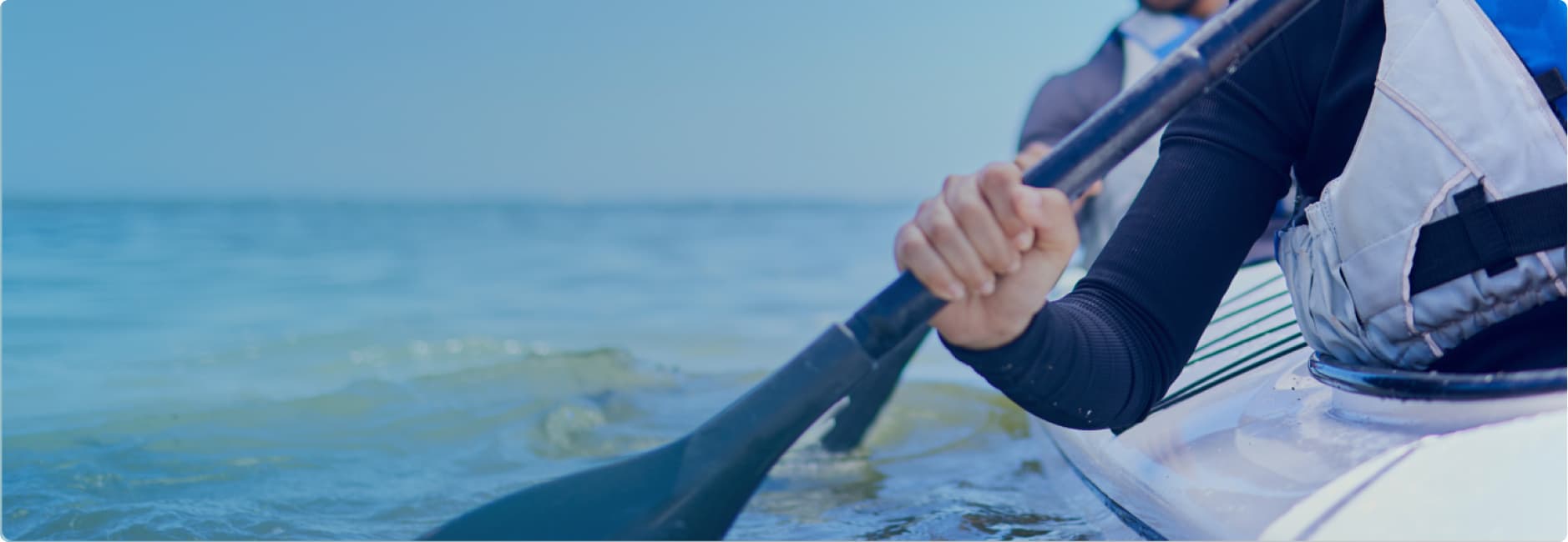 A woman drinking water after exercise